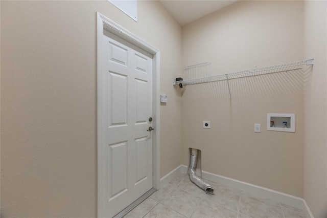 laundry room with light tile patterned flooring, washer hookup, and hookup for an electric dryer