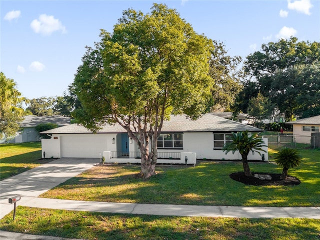 view of front facade with a garage and a front yard