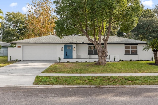 ranch-style home featuring a front lawn and a garage