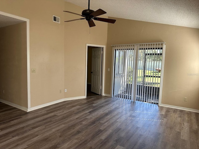 unfurnished room featuring ceiling fan, dark hardwood / wood-style flooring, a textured ceiling, and high vaulted ceiling