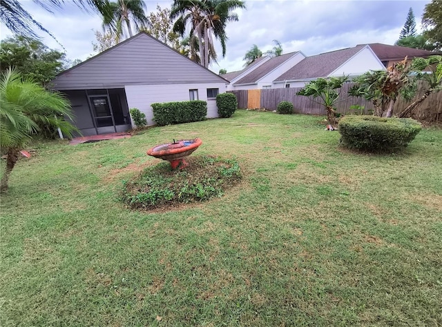 view of yard featuring a sunroom