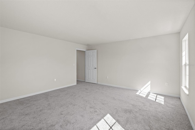 empty room featuring light carpet