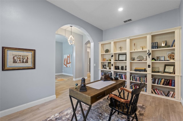 office space with light wood-type flooring