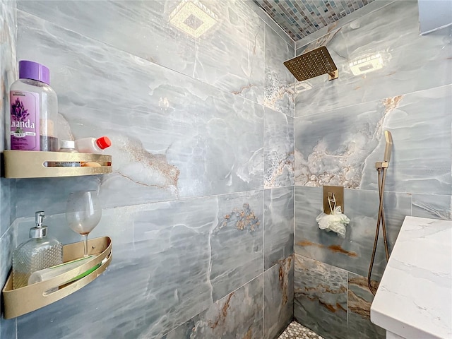 bathroom with a shower and tile walls