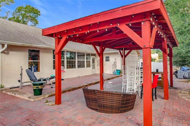 view of patio / terrace with a gazebo and an outdoor bar