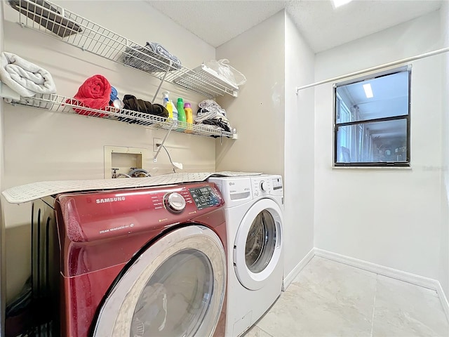 washroom with washer and dryer