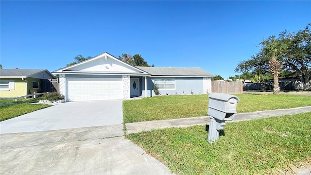 single story home with a front yard and a garage