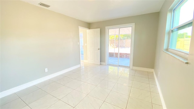 view of tiled spare room