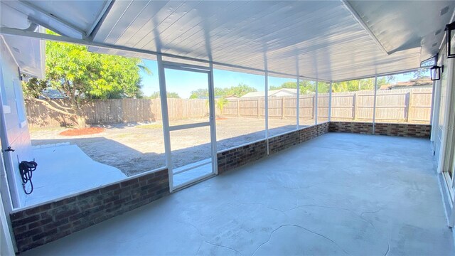 unfurnished sunroom featuring plenty of natural light