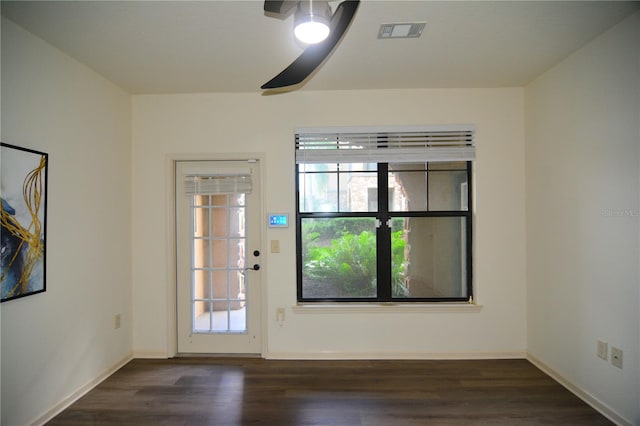 unfurnished room featuring dark wood-type flooring