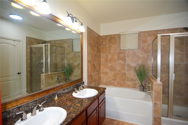 bathroom with tile patterned flooring, vanity, and independent shower and bath