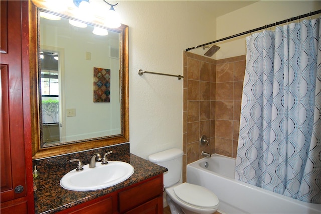 full bathroom with vanity, shower / bath combination with curtain, and toilet