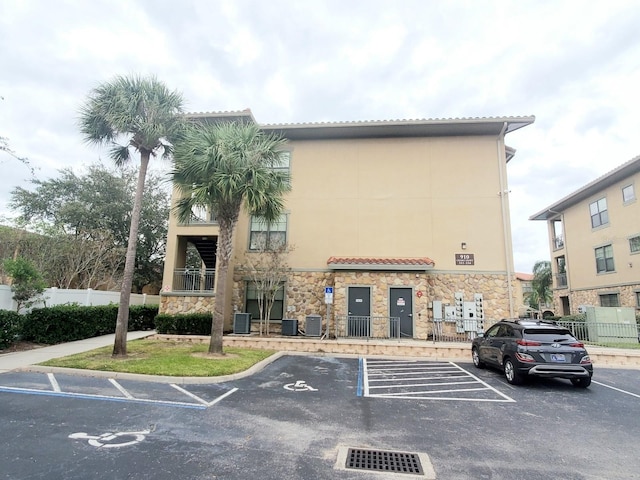 view of building exterior with central AC unit