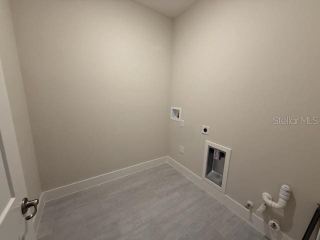 laundry area with hookup for an electric dryer, washer hookup, and hookup for a gas dryer