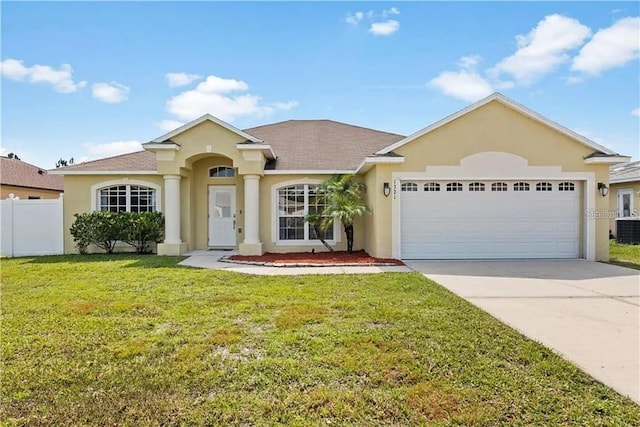 ranch-style home with central AC, a garage, and a front lawn