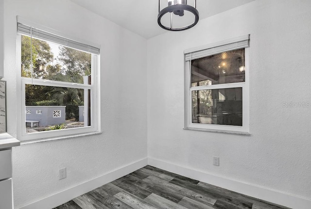 unfurnished room featuring dark hardwood / wood-style floors