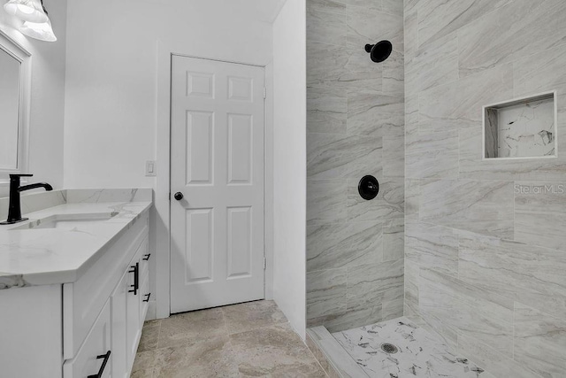 bathroom featuring vanity and a tile shower