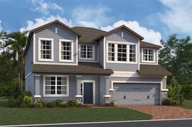 view of front of home featuring a front yard and a garage