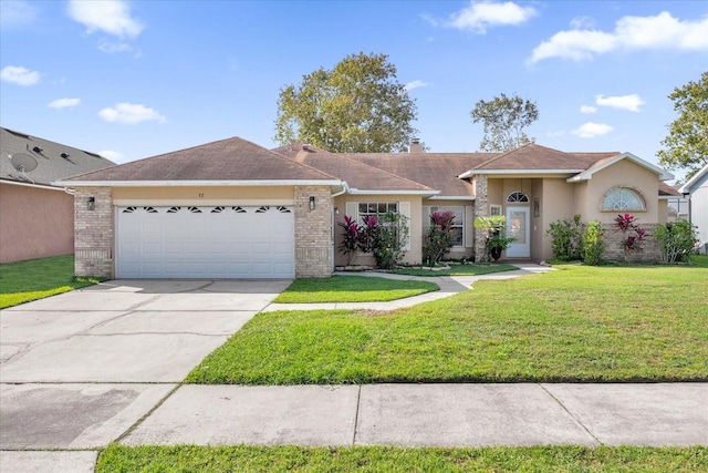 single story home featuring a front lawn and a garage