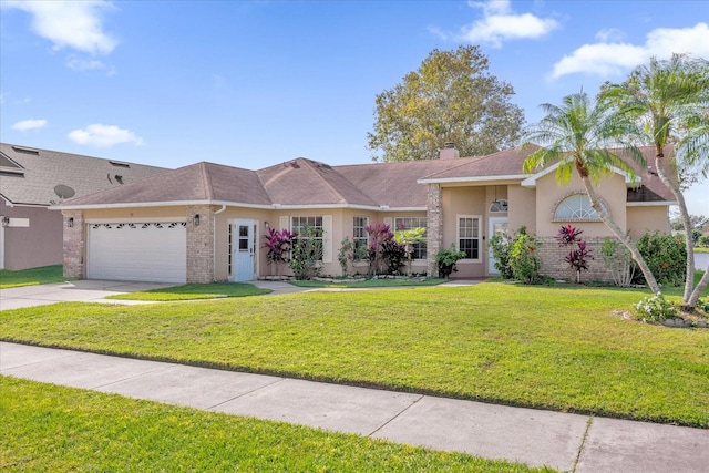 single story home with a front yard and a garage