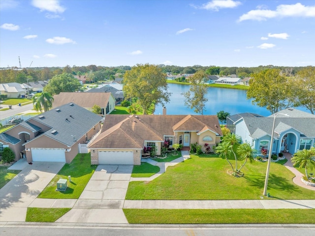 birds eye view of property featuring a water view