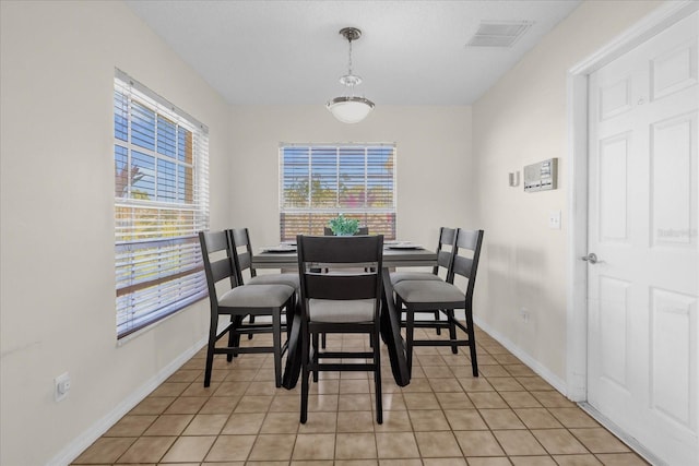 dining room with light tile patterned flooring