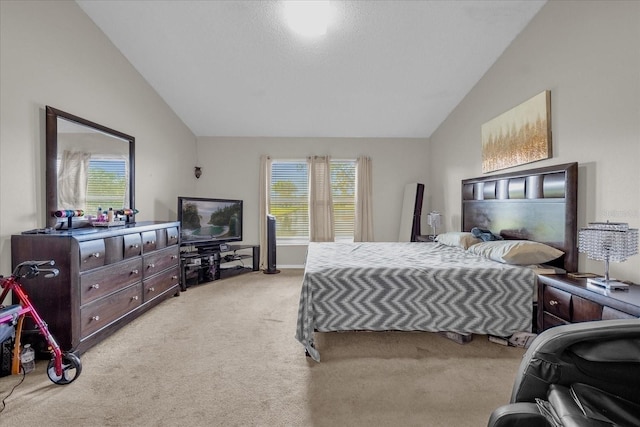 bedroom featuring light colored carpet, multiple windows, and vaulted ceiling