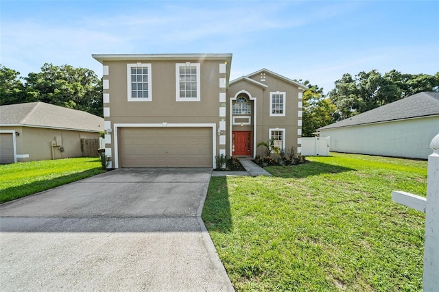 view of front of property featuring a front yard and a garage