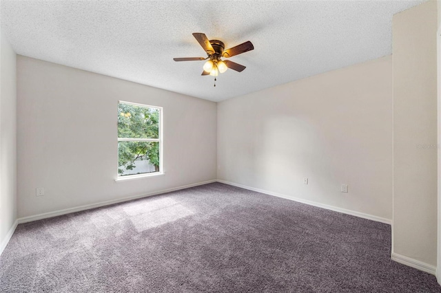 unfurnished room with dark colored carpet, ceiling fan, and a textured ceiling