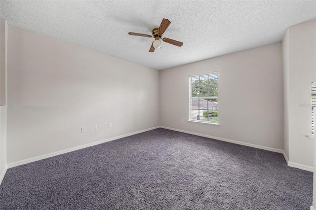 empty room featuring carpet, ceiling fan, and a textured ceiling