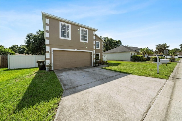 view of front facade with a front lawn and a garage