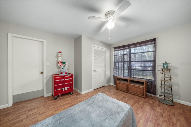 bedroom featuring a closet, ceiling fan, and hardwood / wood-style floors