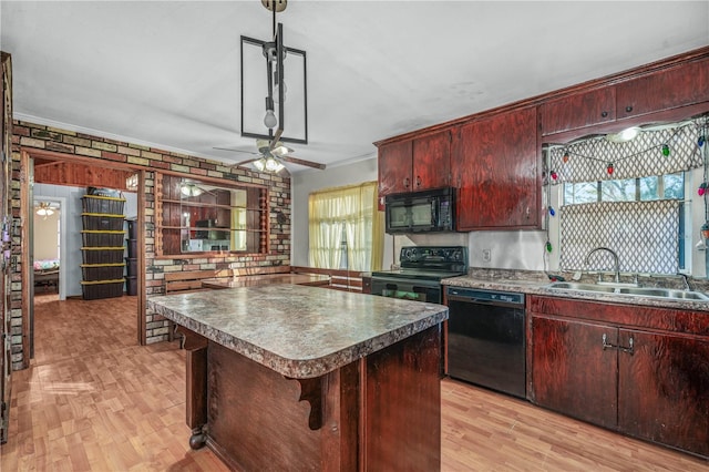 kitchen featuring ornamental molding, sink, black appliances, and light hardwood / wood-style floors