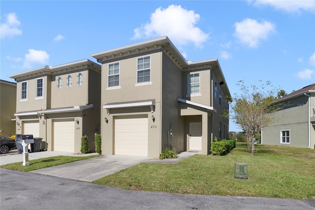 view of front of house featuring a front yard and a garage