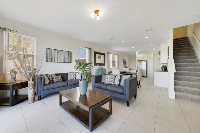 470 Lake Shore Pkwy, Davenport, FL 33896 - living room featuring light tile patterned floors, stairs, and recessed lighting