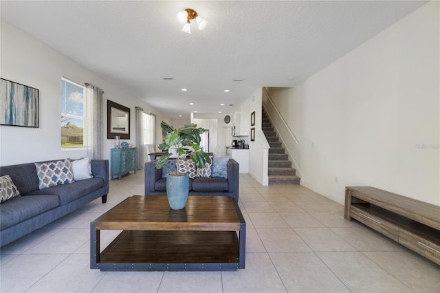 tiled living room with a textured ceiling