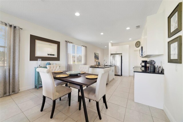 470 Lake Shore Pkwy, Davenport, FL 33896 - dining space with light tile patterned floors, baseboards, and recessed lighting