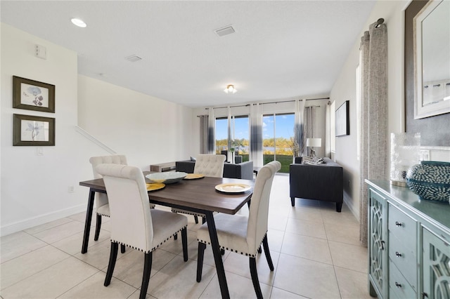 dining space with light tile patterned floors