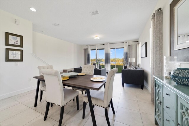 470 Lake Shore Pkwy, Davenport, FL 33896 - dining area with baseboards, light tile patterned floors, and recessed lighting