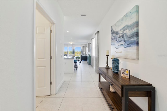 hallway featuring light tile patterned floors