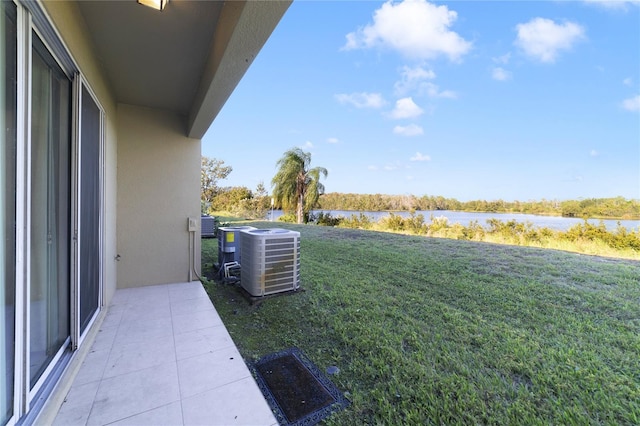 view of yard featuring a water view and cooling unit