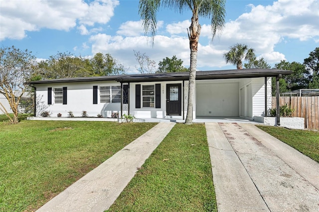 ranch-style house with a front lawn and a carport