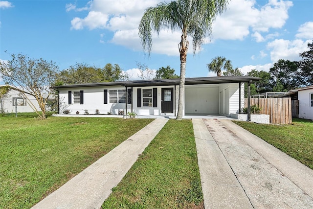 ranch-style house with a front lawn and a carport