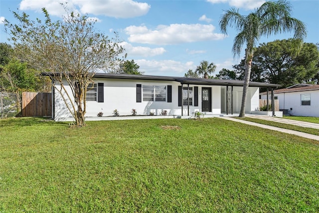 ranch-style house featuring a front lawn and a carport