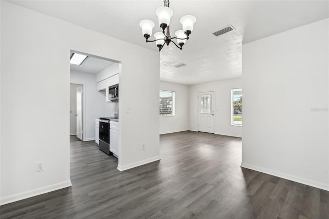 interior space featuring dark hardwood / wood-style floors and a chandelier