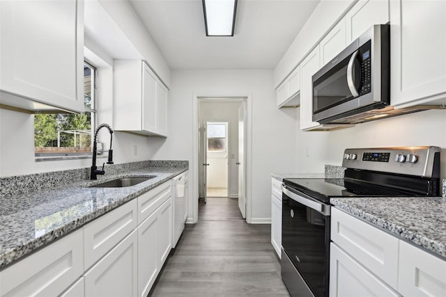 kitchen featuring white cabinets, dark hardwood / wood-style floors, sink, and appliances with stainless steel finishes