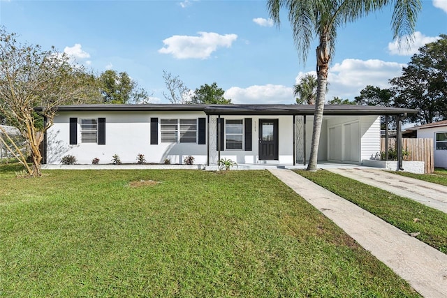 view of front of house featuring a front yard and a carport