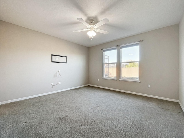 unfurnished room featuring carpet flooring, a textured ceiling, and ceiling fan