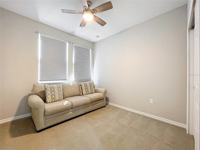 living room featuring light carpet and ceiling fan