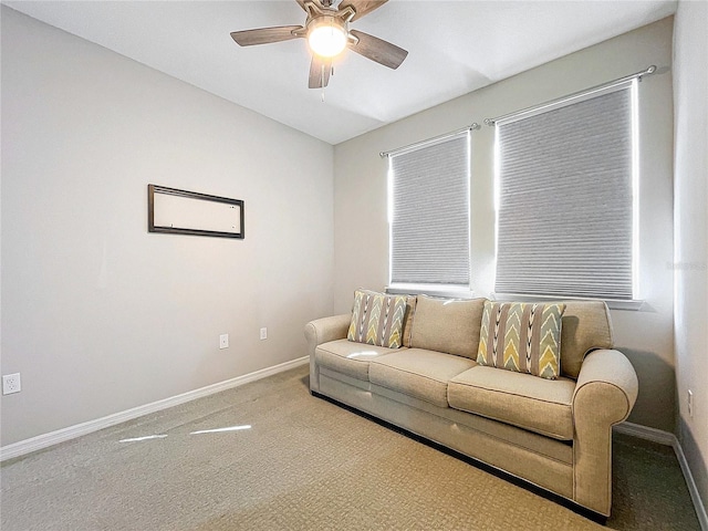 living room with light colored carpet and ceiling fan